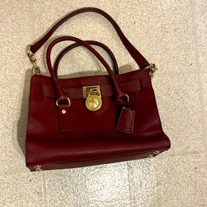 Maroon medium sized Michael Kors handbag